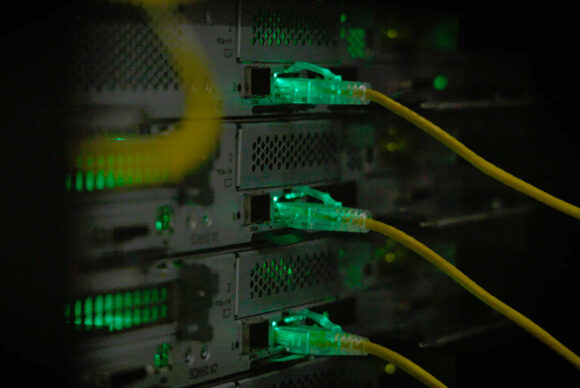 Yellow wires attached to graphics processing units within the Kempner's AI cluster.